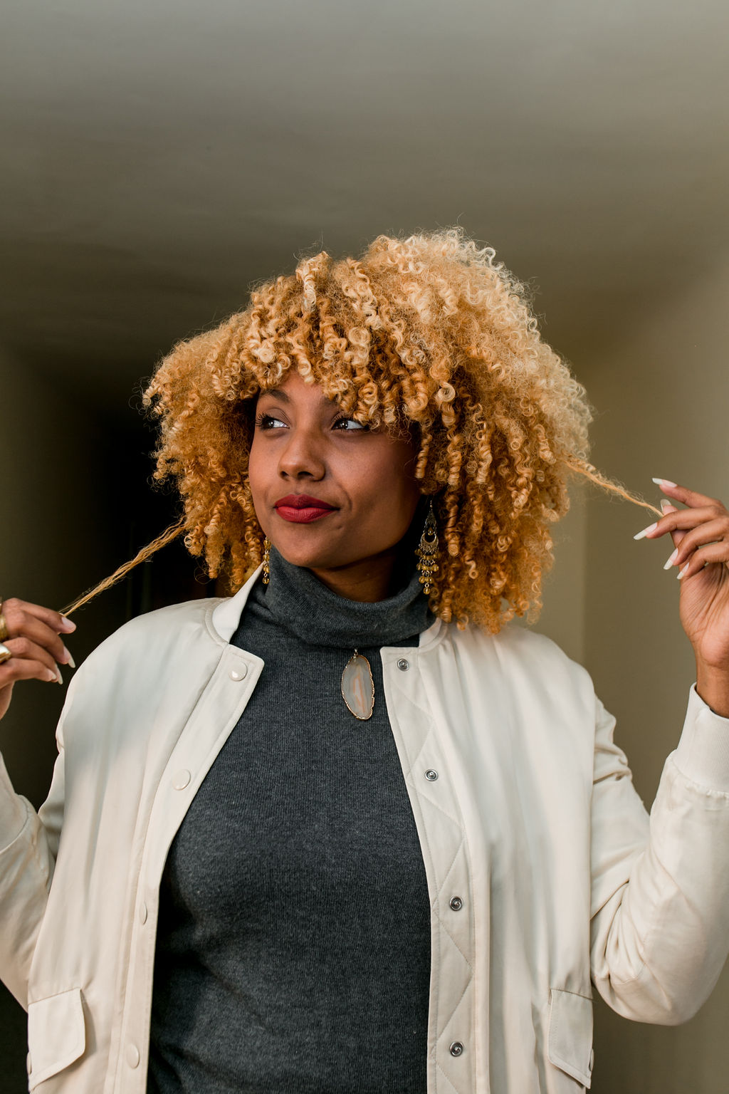 woman with blonde curly hair