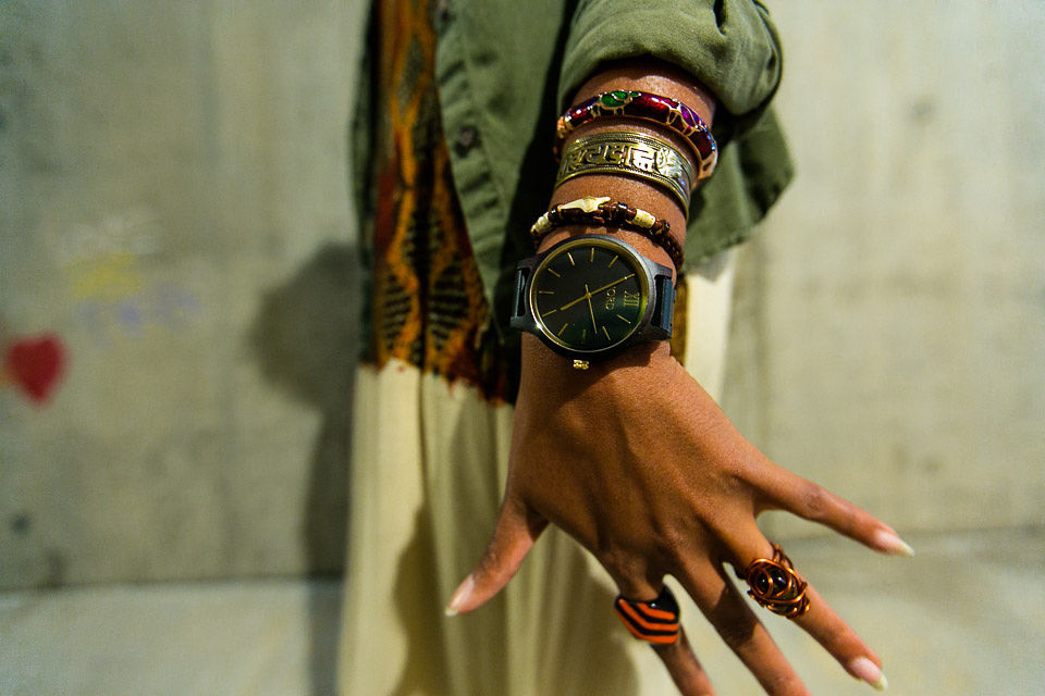 girl with wood watch and jewelry on wrist