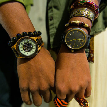 black couple holding hands wearing Jord wood watches