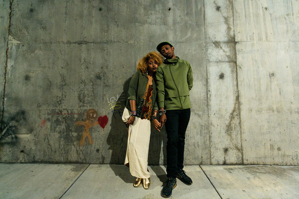 fashion black couple holding hands wearing wood watches