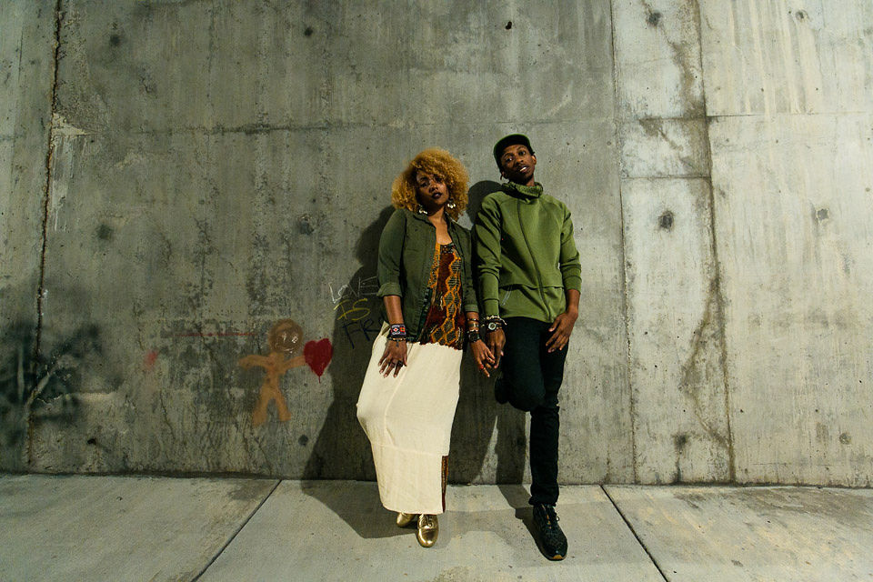 stylish black couple holding hands wearing jord wood watches