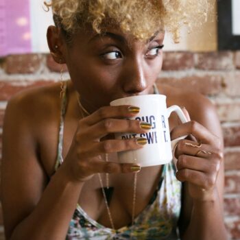 girl sipping coffee-creole amour-wear who you are-lcm