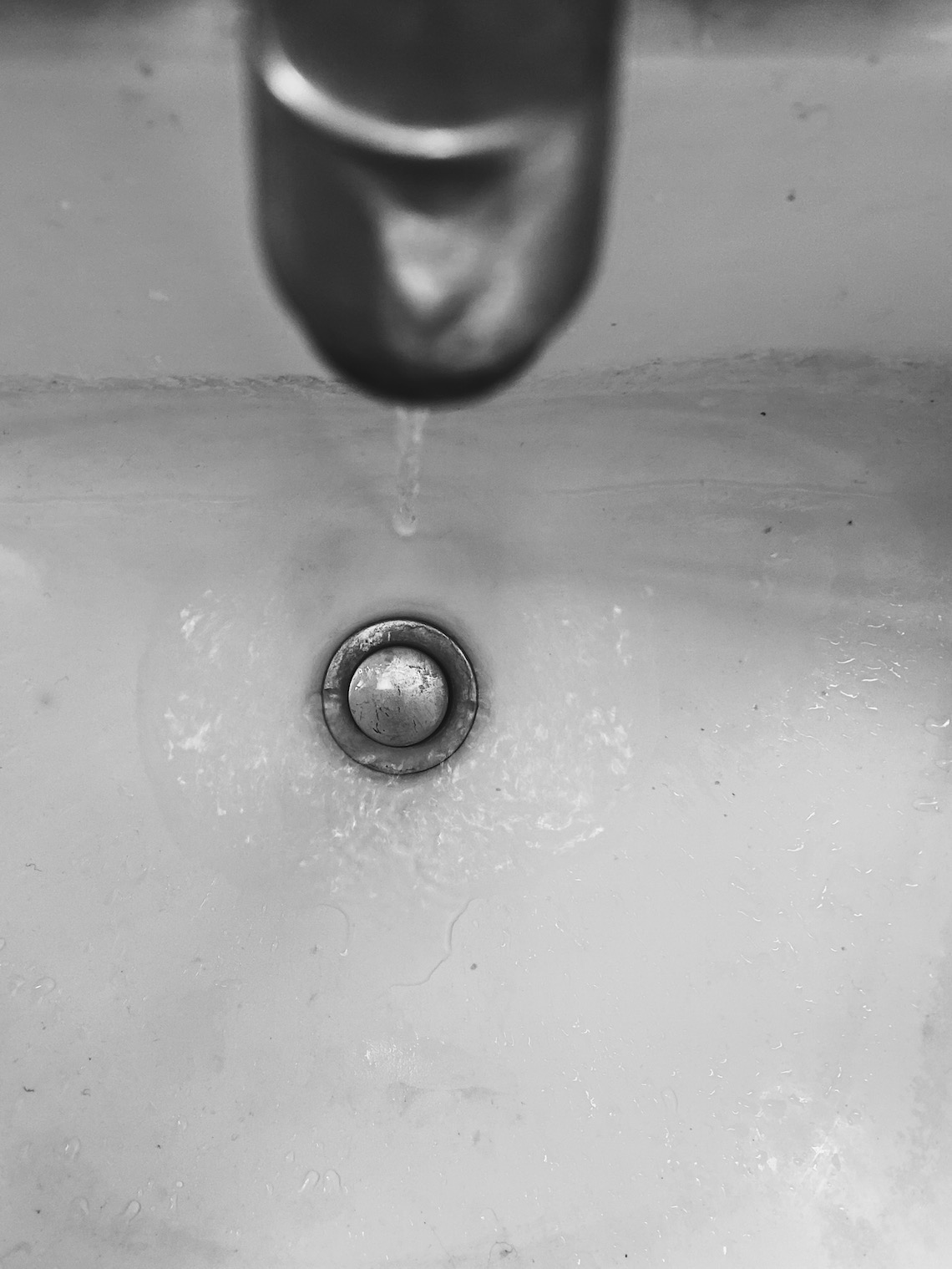 bathroom sink-running water-skin care routine