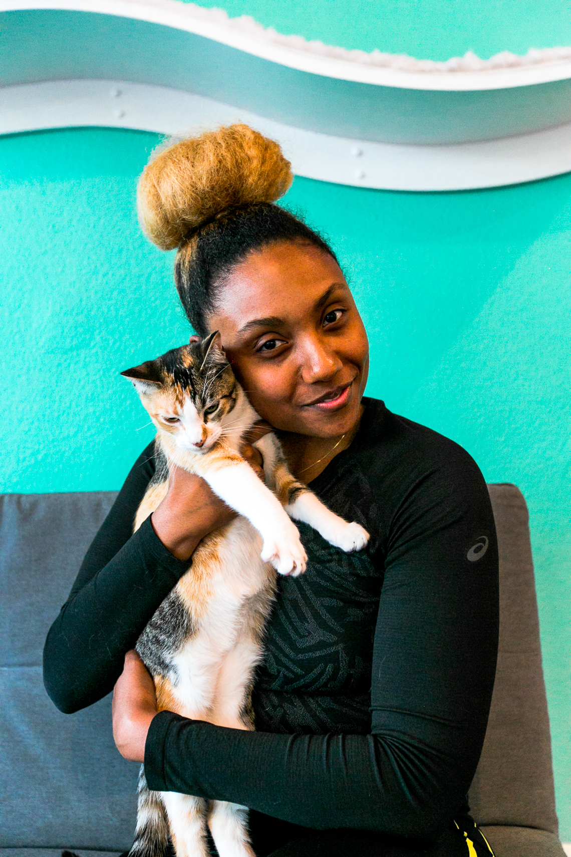 girl hugging cat-feline good social club-long beach-rsee-xmmtt-yoga