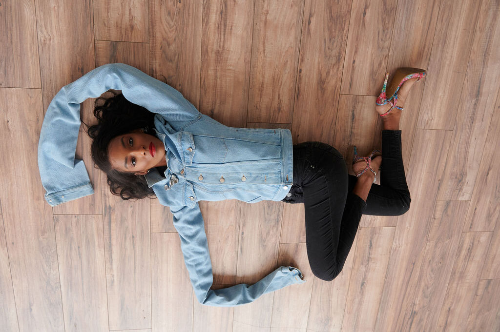Annjulia Smalls In Y/Project-styled by melissa-lcm-sheldon botler photography-denim jacket-elongated sleeves-high fashion-model-hardwood floor